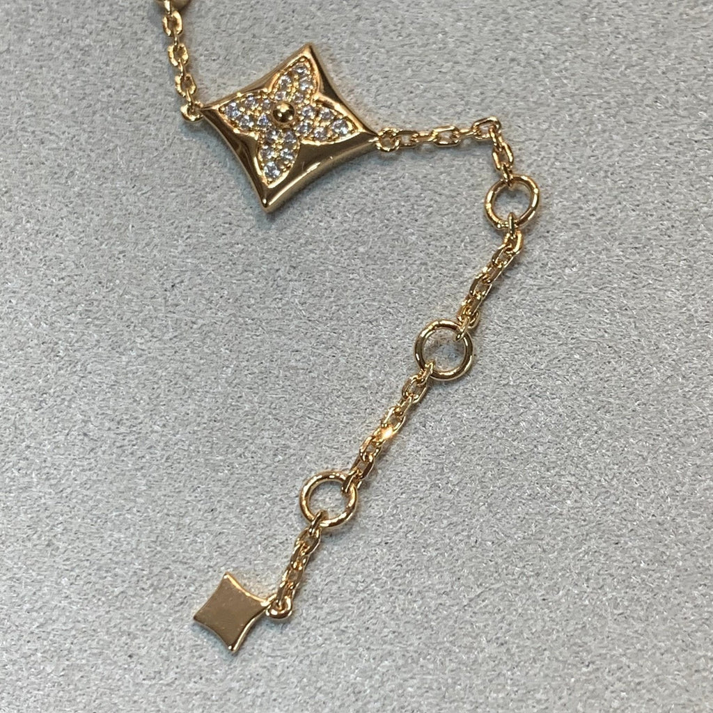 Aura Stern- und Sonnenarmband mit 4 Motiven aus Gold und Diamanten