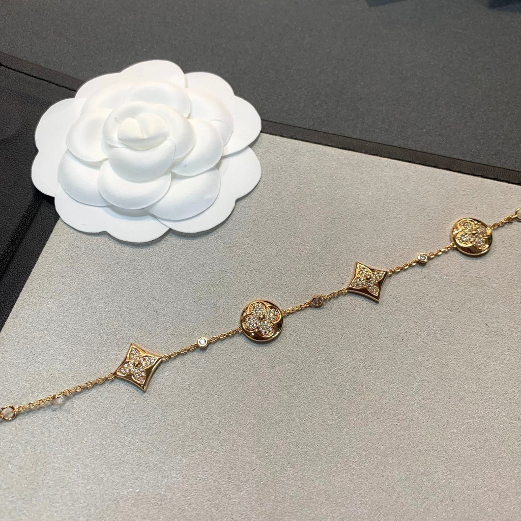 Aura Stern- und Sonnenarmband mit 4 Motiven aus Gold und Diamanten