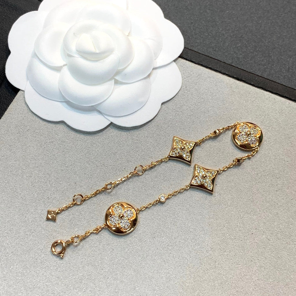 Aura Stern- und Sonnenarmband mit 4 Motiven aus Gold und Diamanten