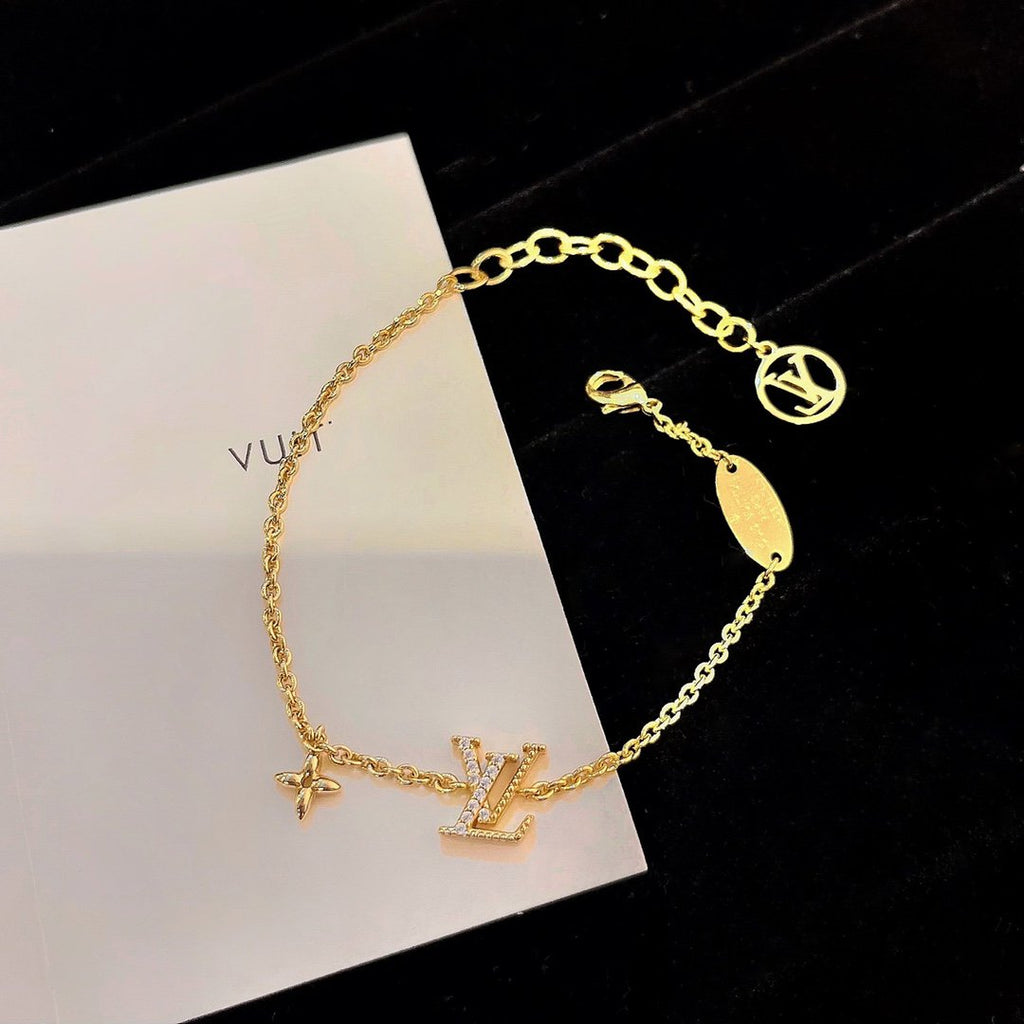 Aura LOGO STAR MOTIF GOLD BRACELET