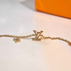 Aura LOGO STAR MOTIF GOLD BRACELET