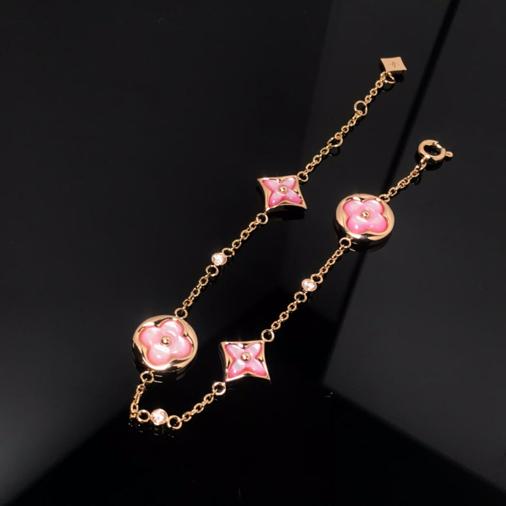 Aura STAR AND SUN 4 MOTIF PINK MOP PINK GOLD BRACELET