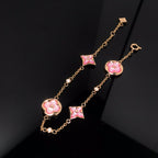 Aura STAR AND SUN 4 MOTIF PINK MOP PINK GOLD BRACELET