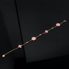 Aura STAR AND SUN 4 MOTIF PINK MOP PINK GOLD BRACELET