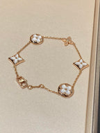 Aura STAR AND SUN 5 MOTIF MOP PINK GOLD BRACELET