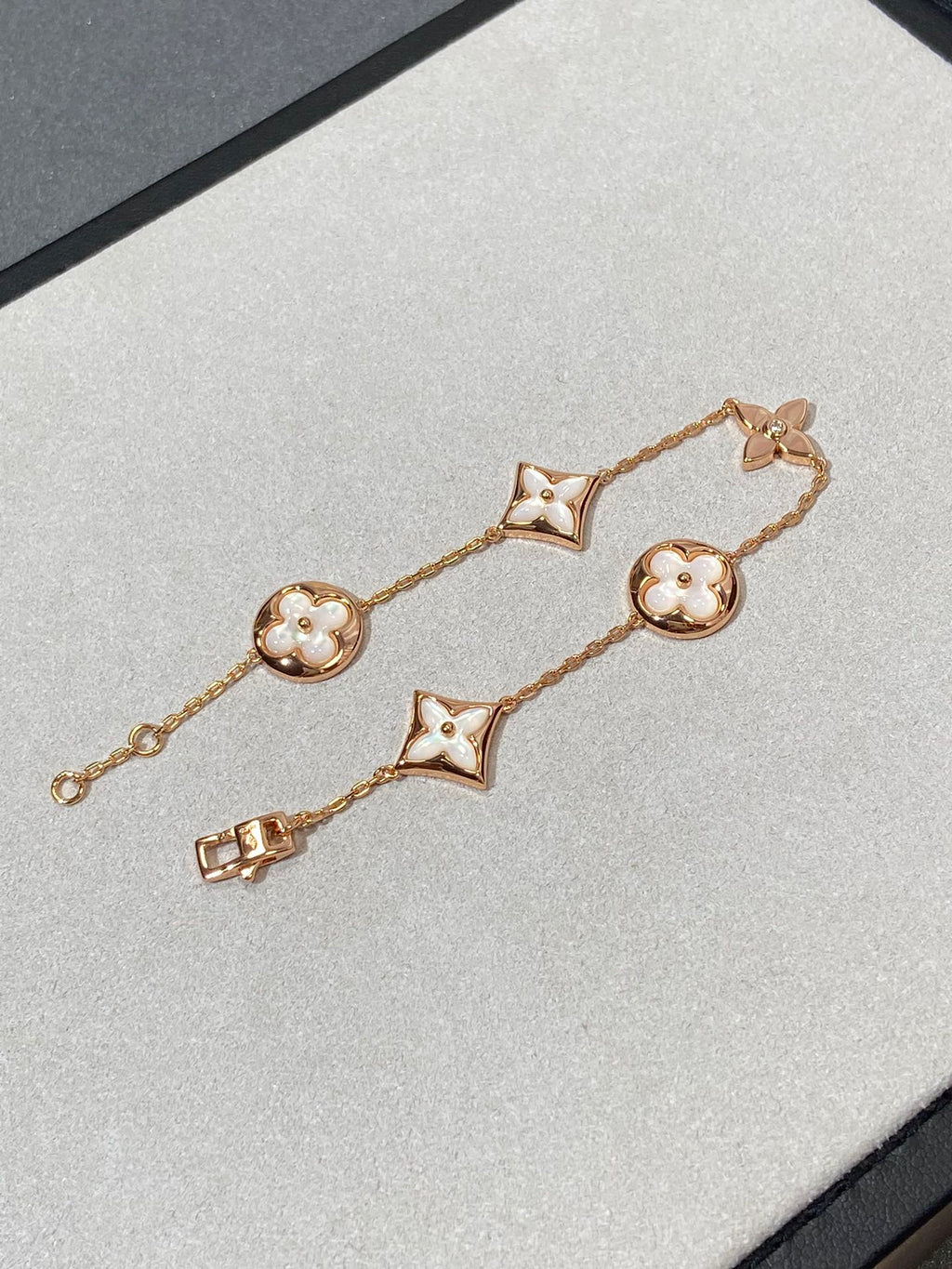 Aura STAR AND SUN 5 MOTIF MOP PINK GOLD BRACELET