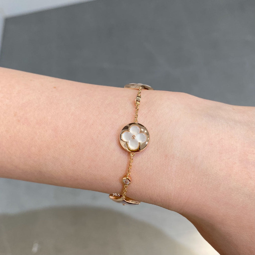 Aura STAR AND SUN 4 MOTIF WHITE MOP PINK GOLD BRACELET