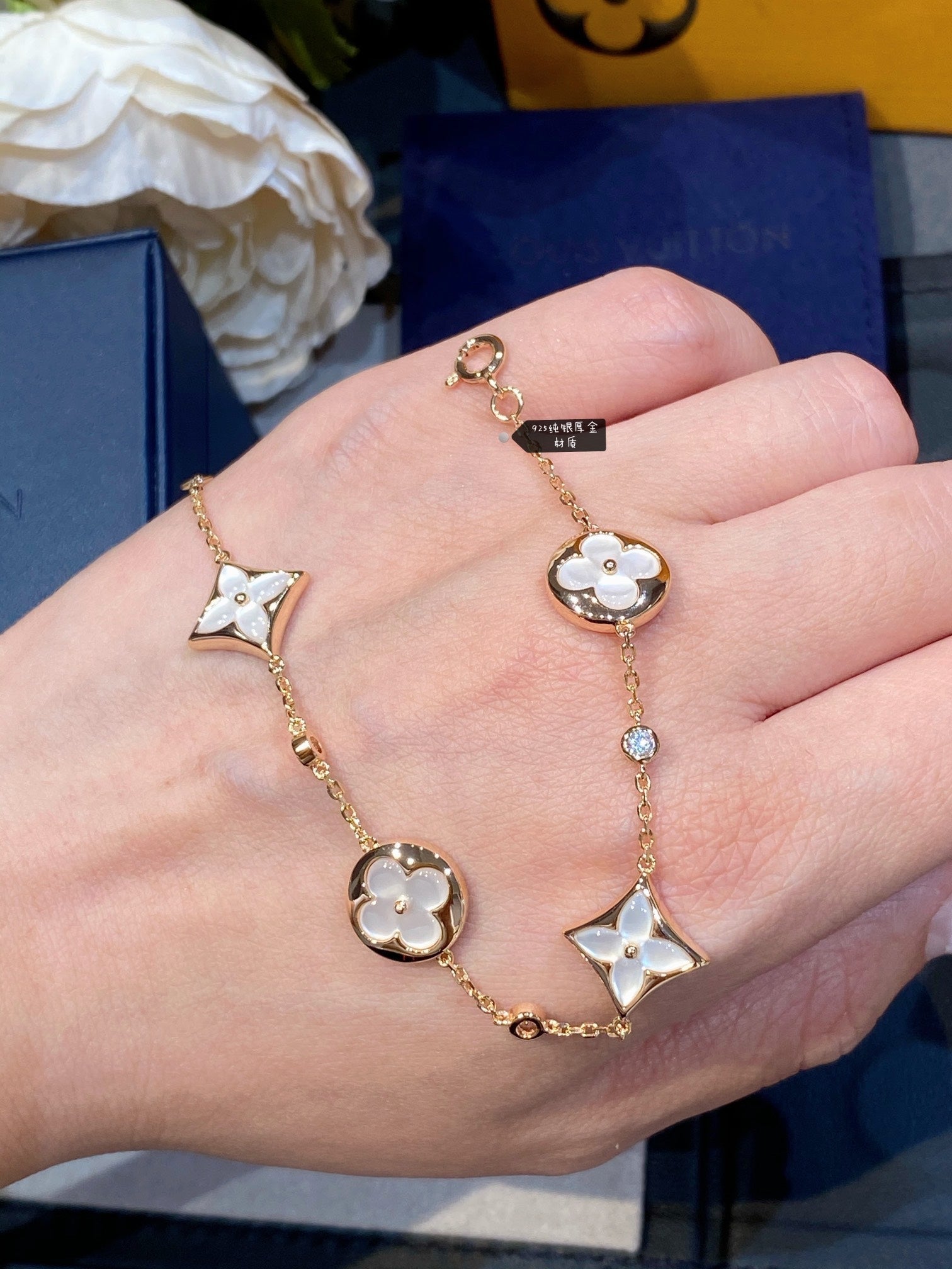 Aura STAR AND SUN 4 MOTIF WHITE MOP PINK GOLD BRACELET