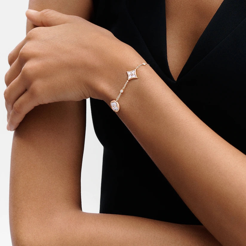 Aura STAR AND SUN 4 MOTIF WHITE MOP PINK GOLD BRACELET