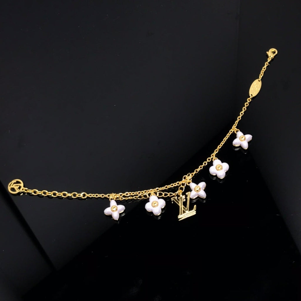 Aura LOGO 6 MOTIF STAR AND SUN GOLD BRACELET