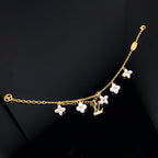 Aura LOGO 6 MOTIF STAR AND SUN GOLD BRACELET