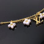 Aura LOGO 6 MOTIF STAR AND SUN GOLD BRACELET