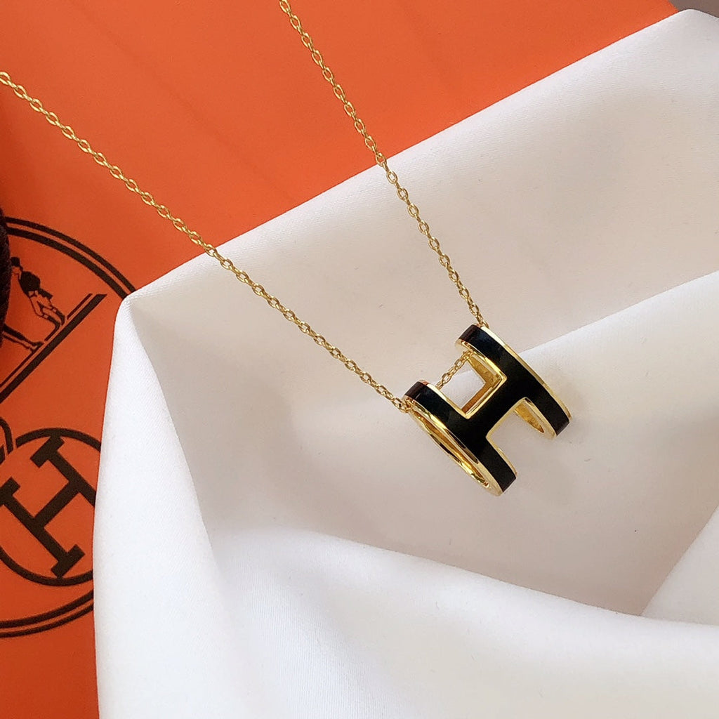 Aura HM CLIC BLACK ENAMEL GOLD NECKLACE