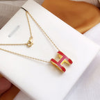 Aura HM CLIC ROTE EMAIL-GOLDHALSKETTE