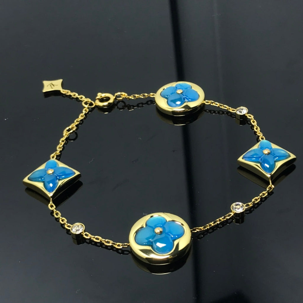 Aura STAR AND SUN 4 MOTIF BLAUES ARMBAND