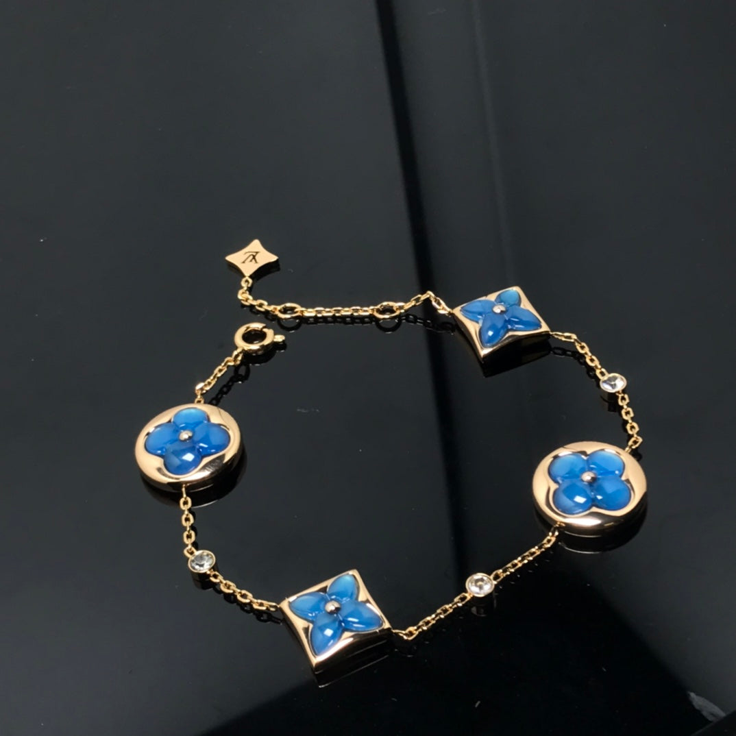 Aura STAR AND SUN 4 MOTIF BLUE BRACELET
